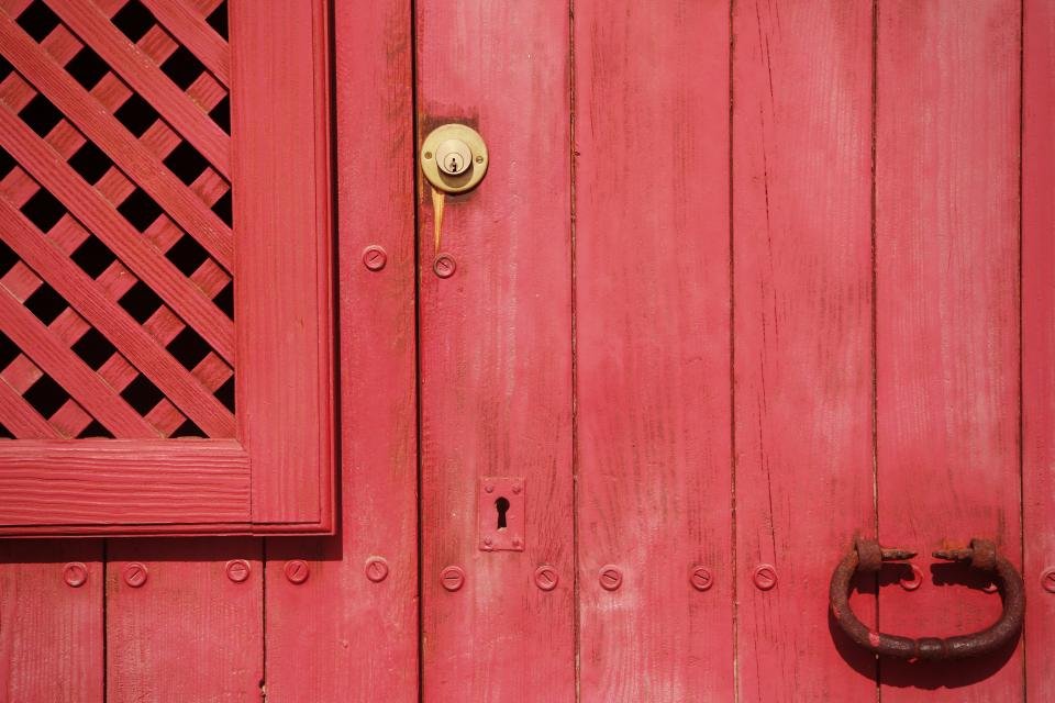 Red front door with a security screen in Clontarf